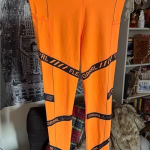 Grrrl Orange Leggings with Black Graphic Accents size XL